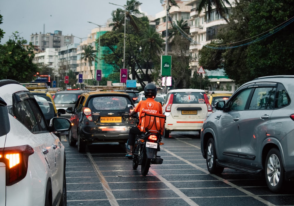 Indian delivery boy riding through traffic to complete orders