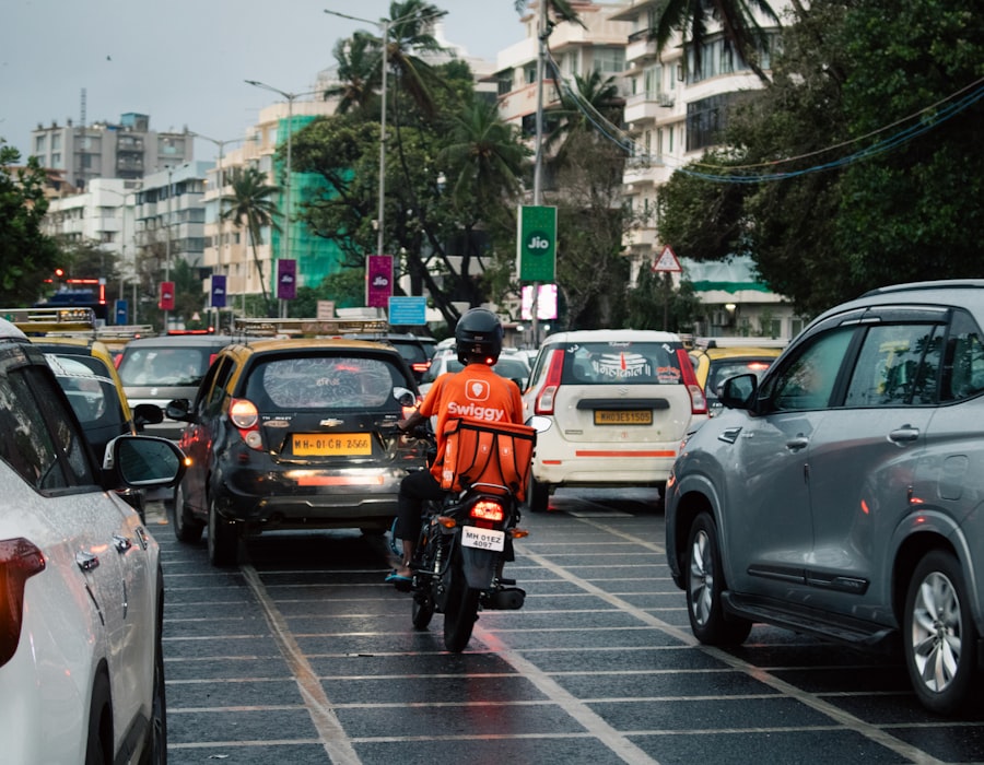 Indian delivery boy on a motorcycle ready for deliveries